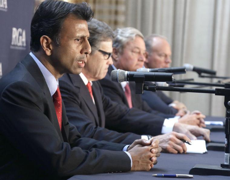 Members of the Republican Governors Association, from left, Louisiana Gov. Bobby Jindal, Gov. Texas Gov. Rick Perry, North Dakota Gov. Jack Dalrymple and Wyoming Gov. Matt Mead, speak during a press conference about Environmental Protection Agency regulations on Monday, June 16, 2014, in Houston. The EPA recently released new rules designed to cut greenhouse gas emissions from existing coal-fired power plants. (AP Photo/Pat Sullivan)