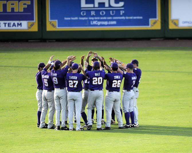 LSU team members huddle before Tigers' 5-1 victory against Houston in Alex Box Stadium on Saturday, May 31, 2014.