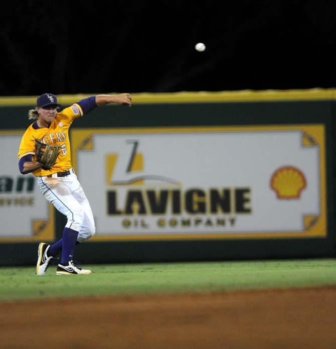 LSU sophomore outfielder Andrew Stevenson (6) throws the ball towards the infield Monday, April 2, 2014 during the Tigers' 12-2 loss against Houston in Alex Box Stadium.