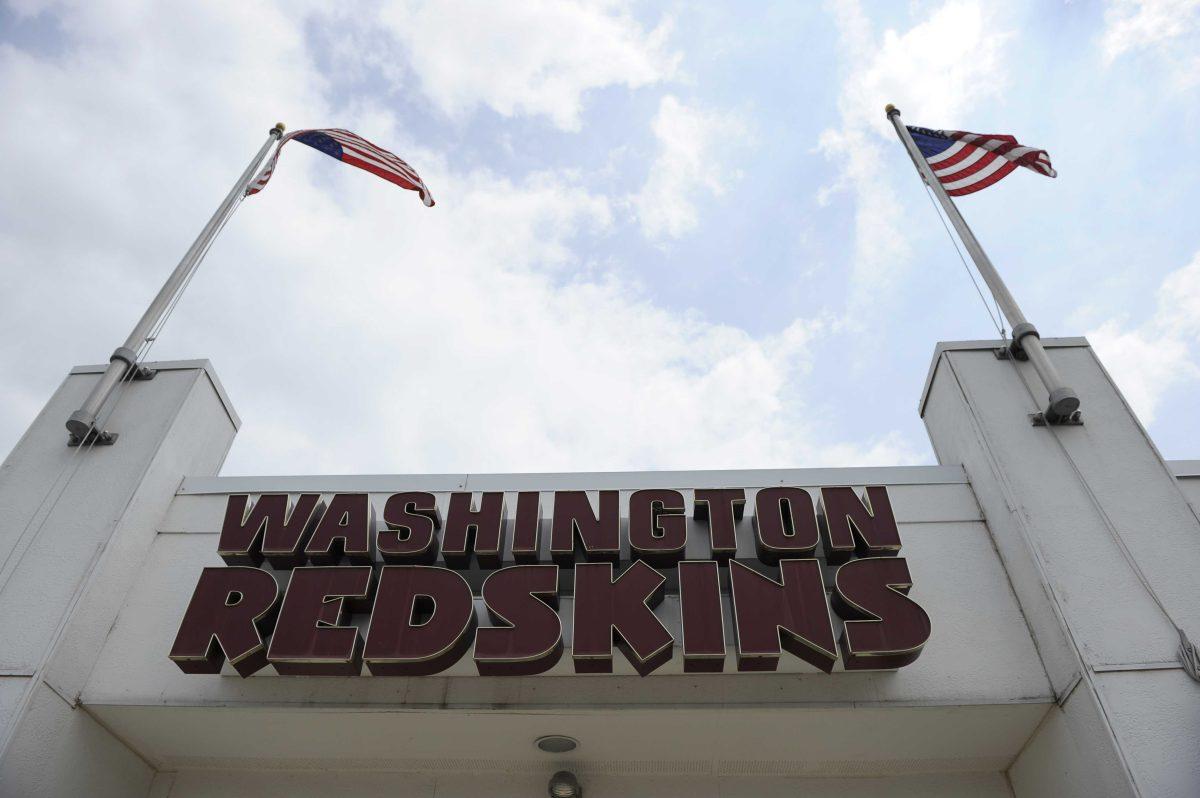 The Washington Redskins name is displayed on a building at their training facility at Redskins Park during NFL football minicamp, Wednesday, June 18, 2014, in Ashburn, Va. The U.S. Patent Office ruled Wednesday, June 18, 2014, that the Washington Redskins nickname is "disparaging of Native Americans" and that the team's federal trademarks for the name must be canceled. The ruling comes after a campaign to change the name has gained momentum over the past year. (AP Photo/Nick Wass)