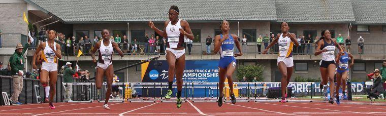 From left to right, LSU's Chanice Chase, Texas A&amp;M's Janeil Bellille, Texas A&amp;M's Shamier Little, Kentucky's Kendra Harrison, LSU's Nikita Tracey, Penn State's Kiah Seymour and Kentucky's Leah Nugent race during the women's 400 meter hurdles at the NCAA track and field championships Friday, June 13, 2014, in Eugene, Ore. Little came in first place. (AP Photo/Rick Bowmer)