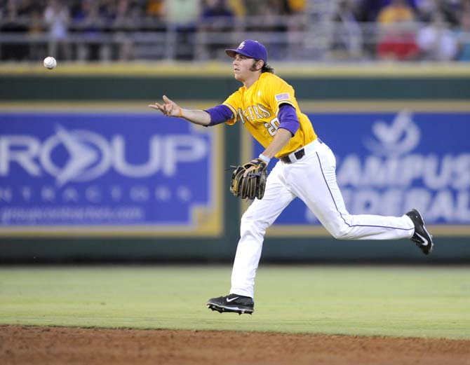 LSU junior infielder Conner Hale (20) tosses the ball to an umpire Monday, June 2, 2014 during the Tigers' 12-2 loss against Houston in Alex Box Stadium.