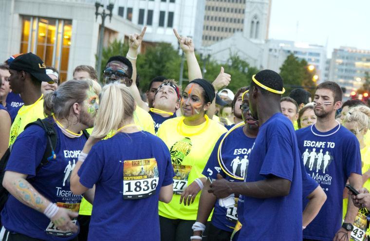 Race participants wait at the starting line Saturday, June 28, 2014 before the post-apocalypse themed 5k race "Escape from Baton Rouge" near the Capitol building downtown.