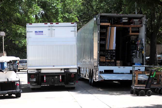 Trucks carrying various film equipment are gathered for the filming of a movie on campus Wednesday, June 18, 2014 near the student union.