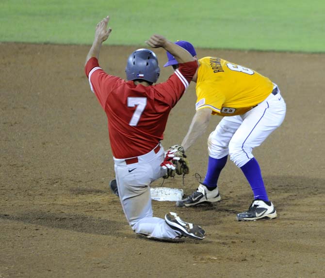 LSU sophomore infielder Alex Bregman (8) tags Houston senior infielder Frankie Ratcliff (7) out at second base Sunday, April 1, 2014 during the Tigers' 5-4 loss against the Cougars in Alex Box Stadium.