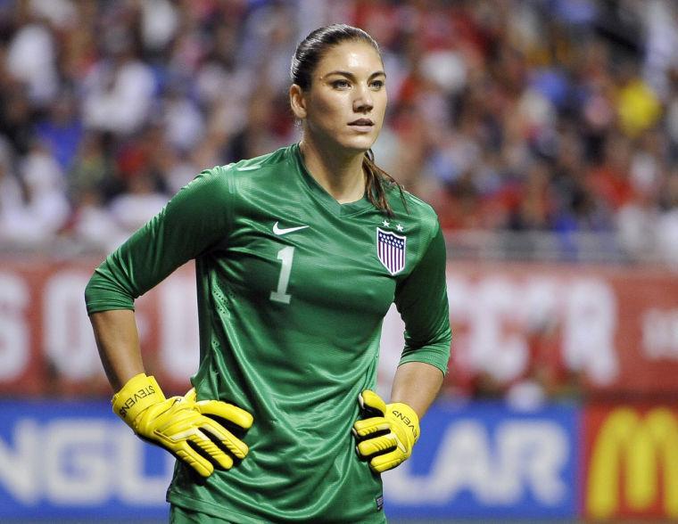 FILE - In this Oct. 20, 2013, file photo, United States goalkeeper Hope Solo pauses on the field during the second half of an international friendly women's soccer match against Australia in San Antonio. Police say Solo has been arrested early Saturday, June 21, 2014, at a suburban Seattle home for assaulting her sister and nephew. (AP Photo/Darren Abate, File)