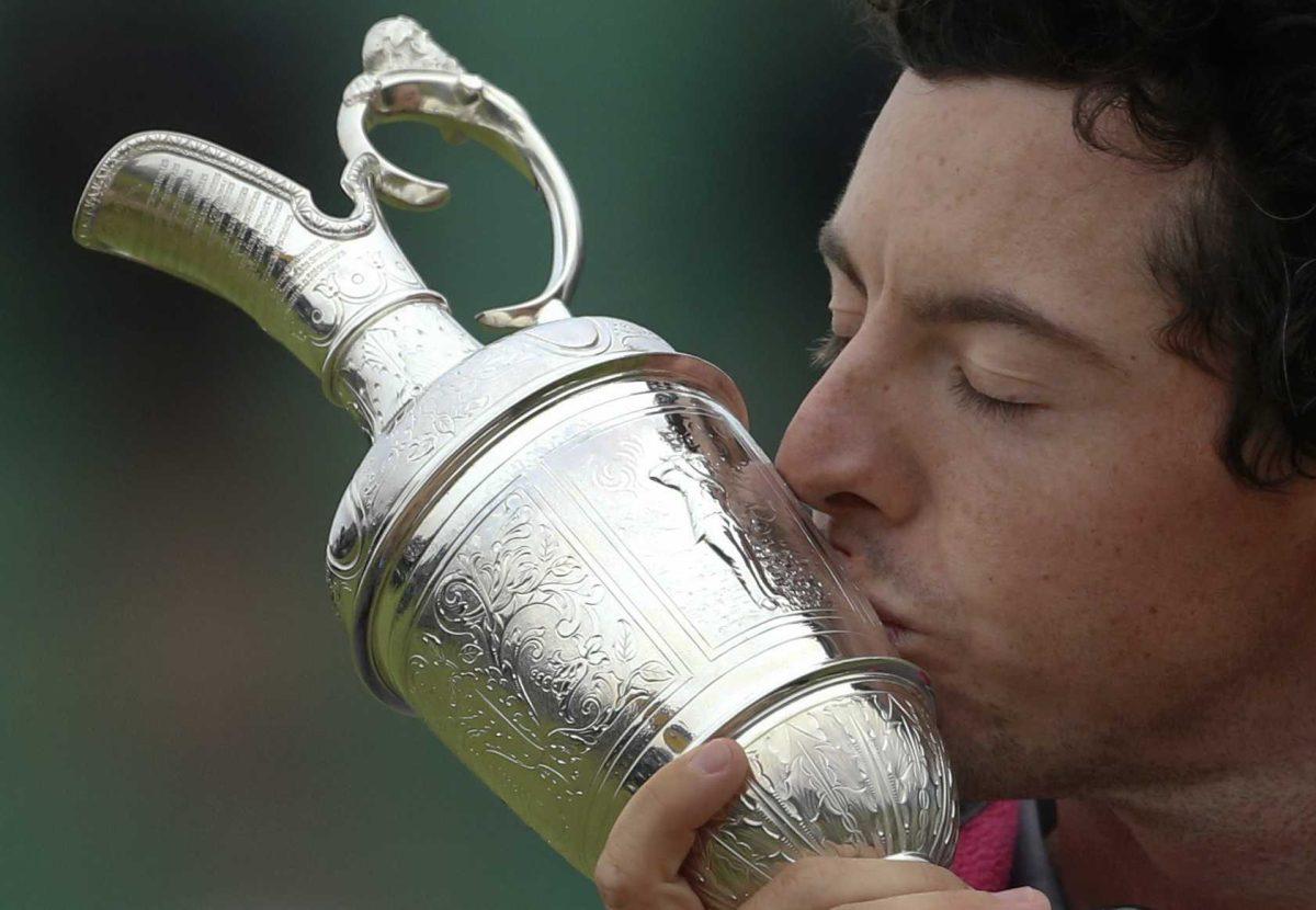 Rory McIlroy of Northern Ireland kisses the Claret Jug trophy after winning the British Open Golf championship at the Royal Liverpool golf club, Hoylake, England, Sunday July 20, 2014. (AP Photo/Peter Morrison)