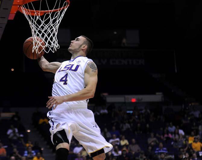 LSU junior guard Keith Hornsby (4) participates in a dunk competition Thursday as a part of Bayou Madness in the PMAC