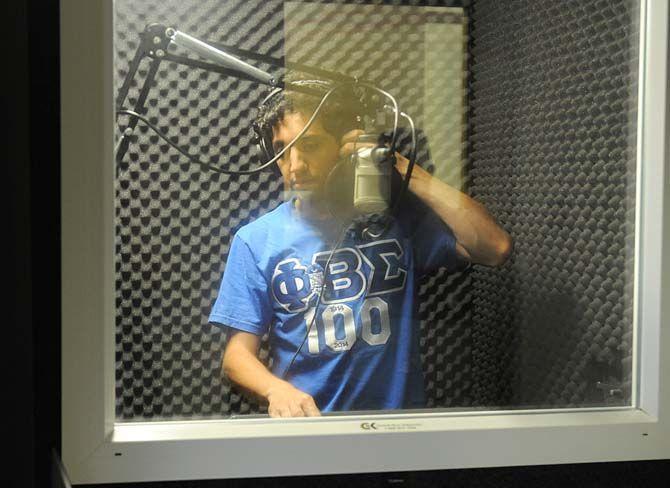 Chemical Engineering senior and rapper Kareem Awad plays one of his tracks in Studio 151 before his opening at LSU's back-to-school concert on Tuesday, August 26, 2014 at the Parade Grounds.