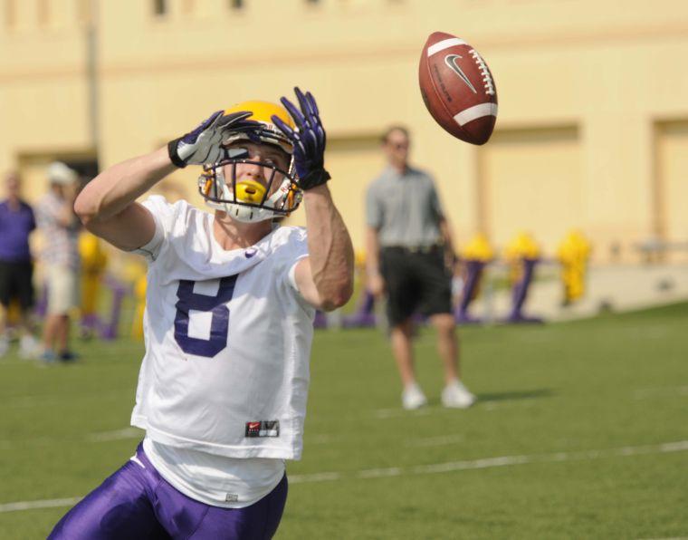 LSU freshman wide receiver Trey Quinn (8) reaches up to catch the ball Monday, August 4, 2014 during Fall Camp.