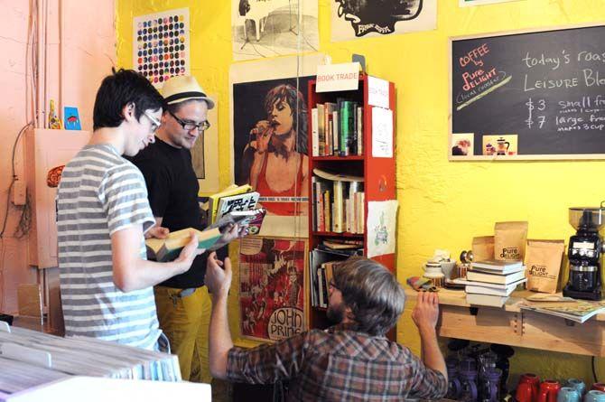 Customers use the new Lagniappe Records book trade Thursday, August 21, 2014 to find new music books.