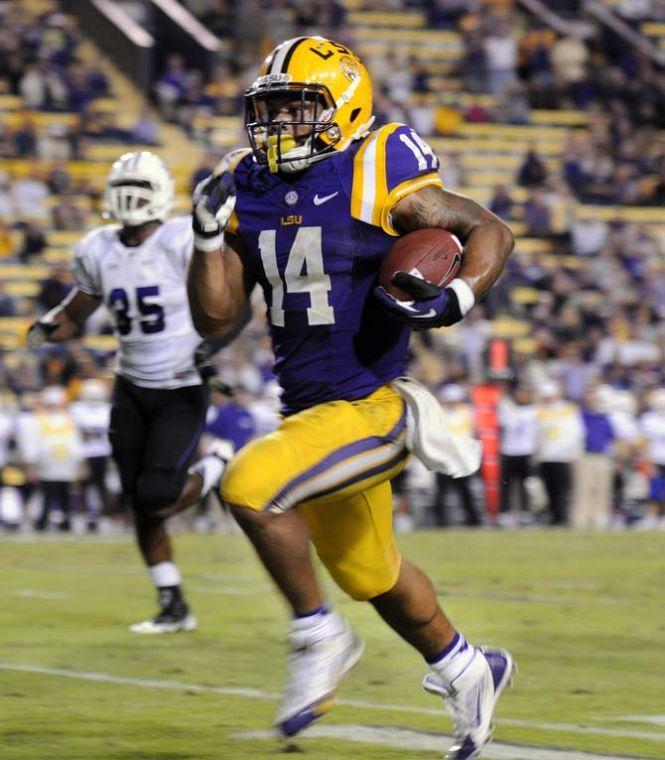 LSU junior running back Terrence Magee (14) rushes down the field Saturday, Oct. 26, 2013, during the Tigers' 48-16 win against Furman in Tiger Stadium.