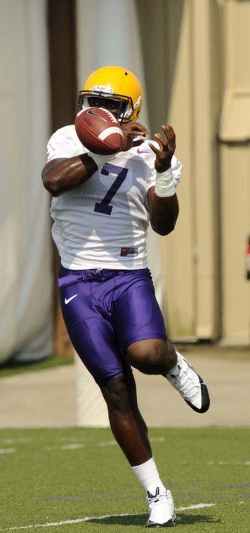 LSU freshman running back Leonard Fournette (7) receives with the ball Monday, August 4, 2014 during Fall Camp.