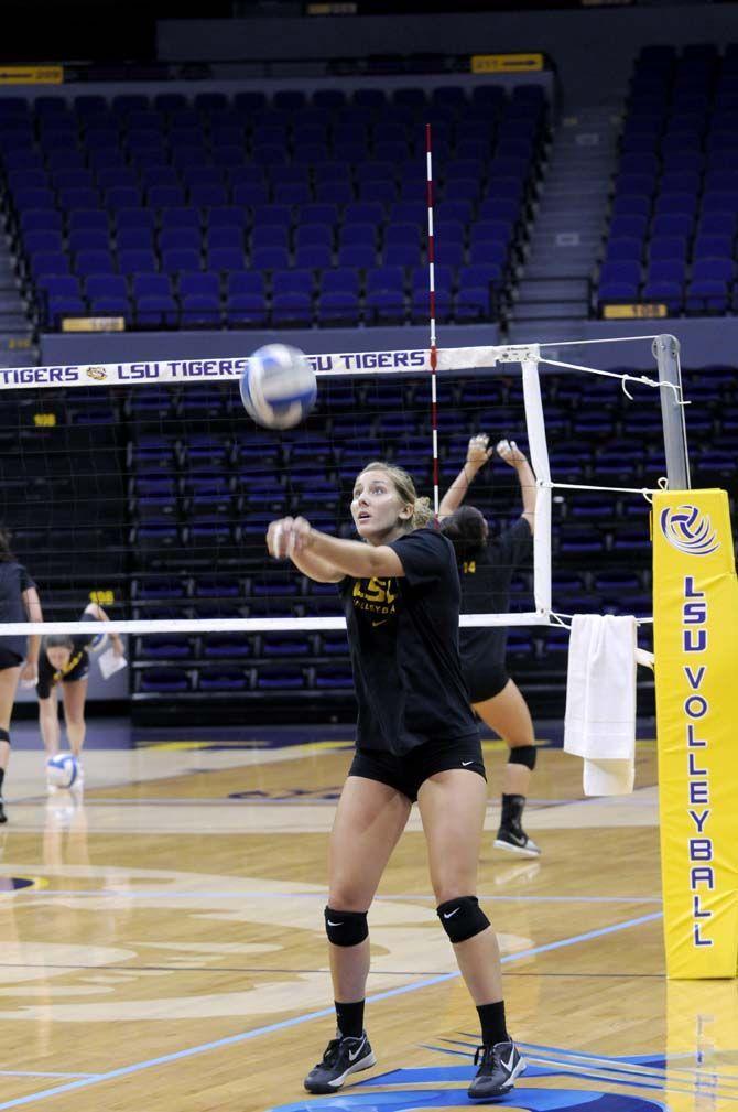 LSU junior defensive specialist Haley Smith (15) warms up Monday, August 25, 2014 in the PMAC.