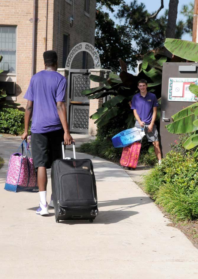 The LSU basketball team assists students with move in day Wednesday August 20, 2014 at the Pentagon.