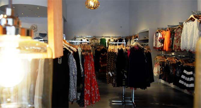 Dresses and accesories display inside The Impecable Pig on Friday August 22, 2014 At Perkins Rowe.