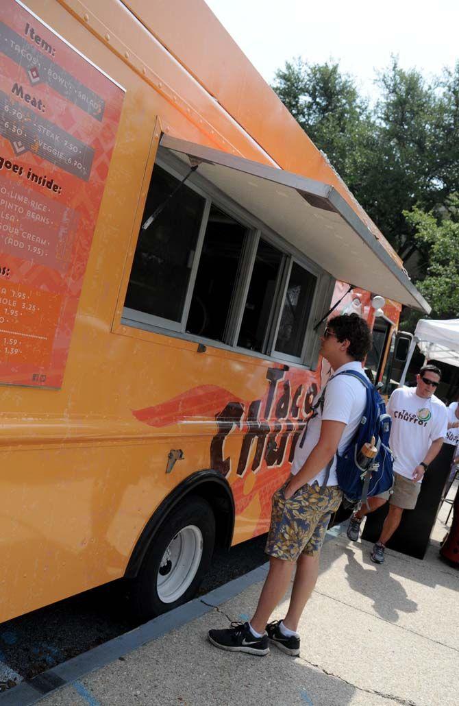 LSU civil engineering senior Pollard Lawson ordering from the first on campus food truck, Taco Churro's, outside the Journalism building on Monday August 25, 2014.