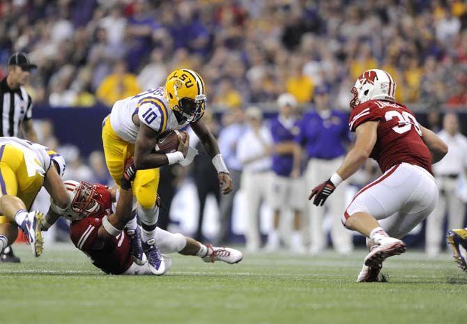 LSU sophomore quarterback Anthony Jennings (10) drives downfield Saturday, August 30, 2014 during the Tigers' 28-24 victory against Wisconsin in the 2014 Advocare Texas Kickoff, held in the NRG Stadium in Houston, Texas.