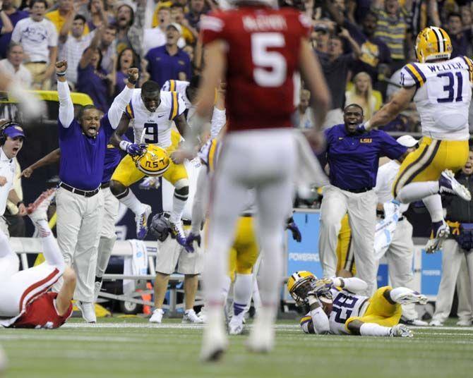 LSU junior safety Jalen Mills (28) lies on the field after intercepting a pass Saturday, August 30, 2014 during the Tigers' 28-24 victory against Wisconsin in the 2014 Advocare Texas Kickoff, held in the NRG Stadium in Houston, Texas.