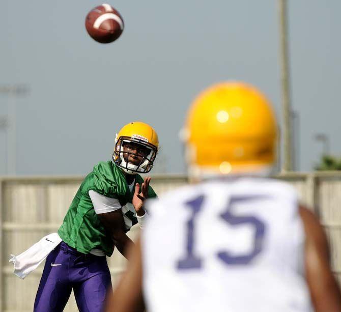 LSU freshman quarterback Brandon Harris (6) passes the ball to freshman wide receiver Malachi Dupre (15) Tuesday, August 5, 2014 during Fall Camp in the Charles McClendon Facility.