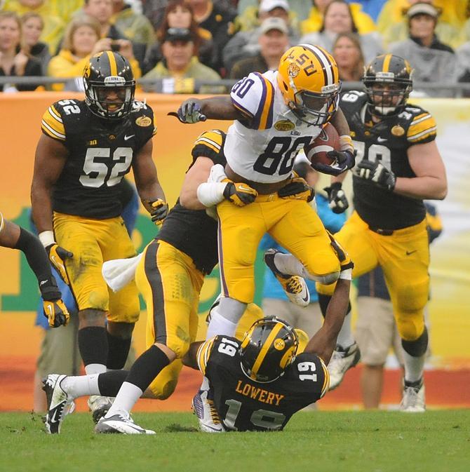 LSU junior wide receiver Jarvis Landry (80) attempts to slip a tackle Wednesday, Jan. 1, 2014 during the Tigers' 21-14 victory against the Iowa Hawkeyes in the Outback Bowl at Raymond James Stadium in Tampa, Florida.