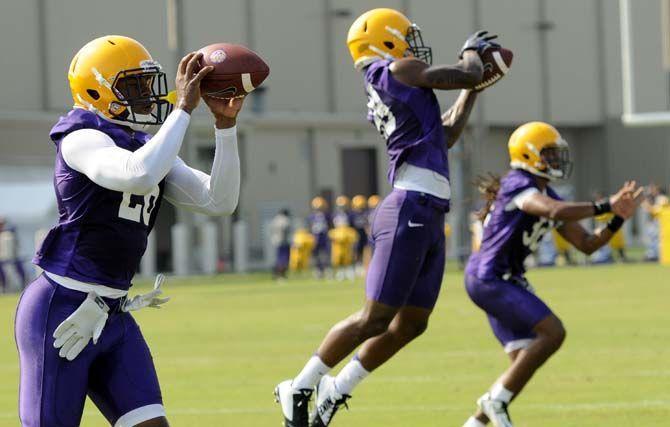 LSU football players run through catching drills Tuesday, August 5, 2014 during Fall Camp in the Charles McClendon Practice Facility.