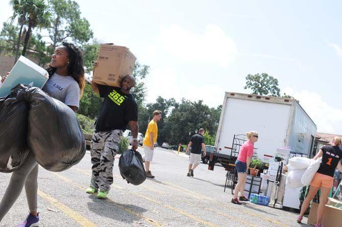 New residents move boxes into the dorms for Move-in Day on August 20, 2014.