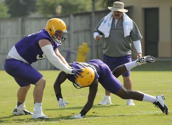 LSU sophomore defensive tackle Christian LaCouture (91) blocks freshman defensive back Russell Gage (39) during a drill Tuesday, August 5, 2014 in the Charles McClendon Practice Facility.