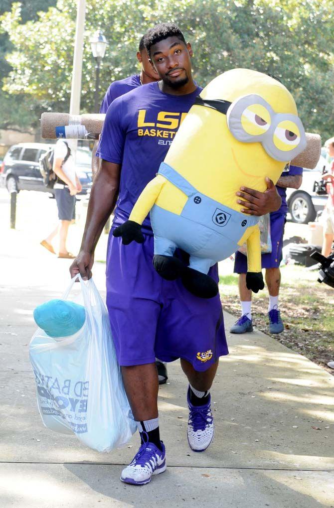 LSU Basketball player Brian Bridgewater assists a student with her giant Minion for move in day on Wednesday August 20, 2014 at the Pentagon.