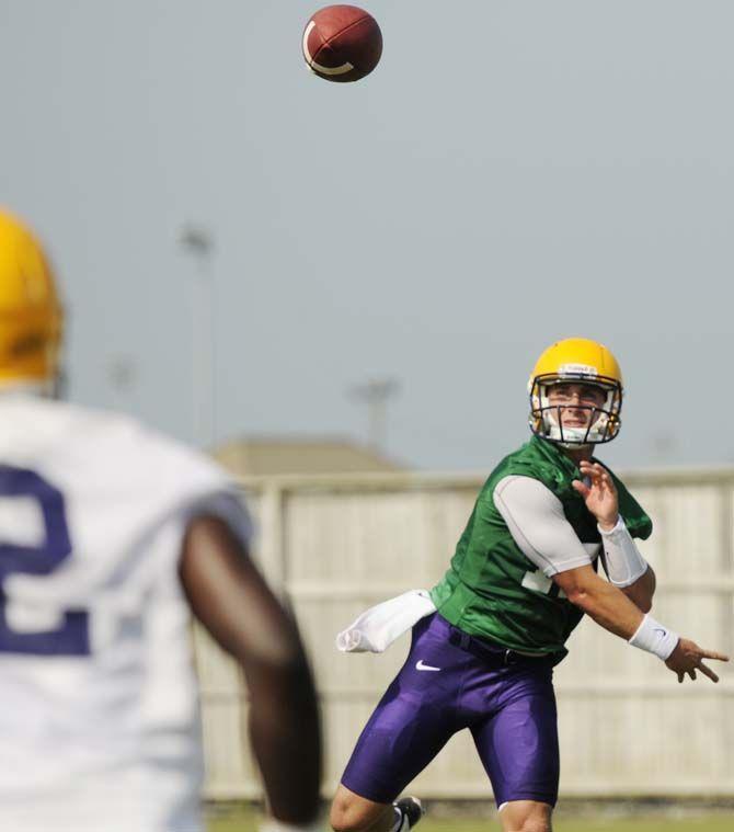 LSU junior quarterback Jared Foster (17) passes the ballTuesday, August 5, 2014 during a drill in the Charles McClendon Practice Facility.