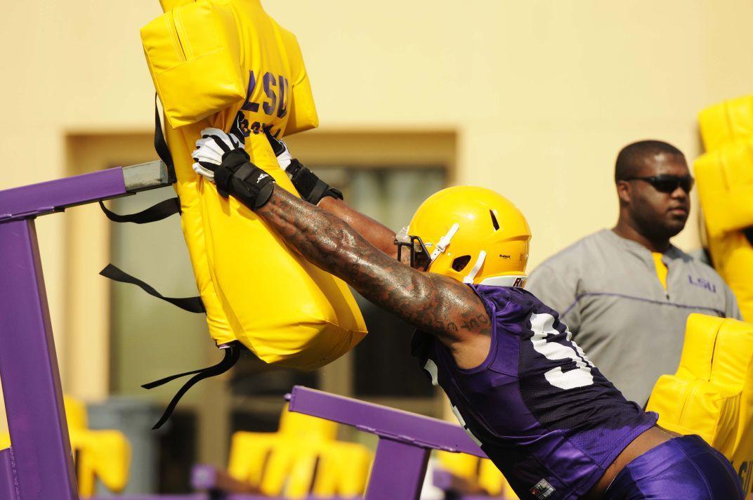 LSU senior defensive end Justin Maclin (54) practices tackling Tuesday, August 5, 2014 at Charles McClendon Practice Facility.