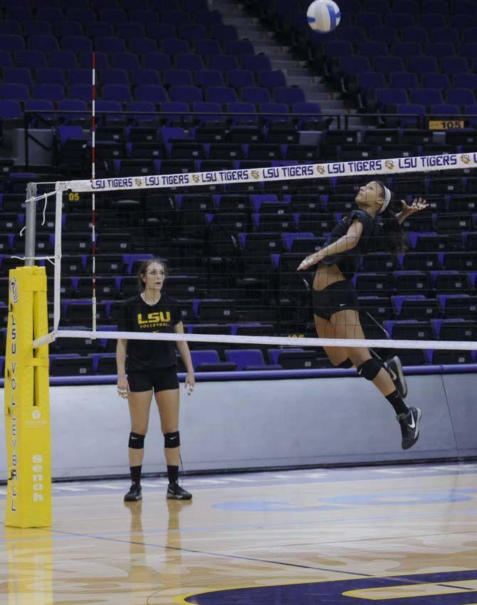 LSU freshman outside hitter Mimi Eugene (10) jumps towards the ball Monday, August 25, 2014 in the PMAC.