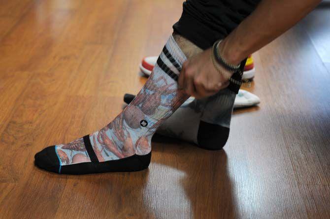 Local designer Hunter Hulin shows off his matching Louisiana themed socks Wednesday August 20, 2014 at the Rukus Board Shop.