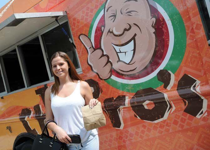 LSU sports administration junior Amanda Martin orders her first Taco Churro's chips and salsa on Monday August 25, 2014 in front of the Journalism building.