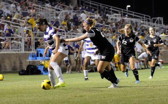 LSU freshman forward Jorian Baucom (5) covers the ball on Friday, August 22, 2014 during the Tigers' 2-0 victory against Troy in LSU Soccer Stadium.