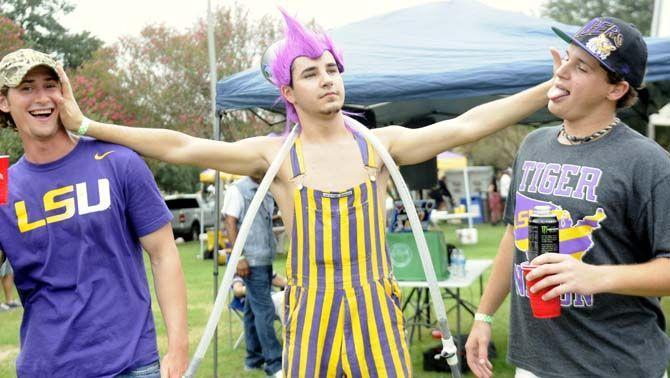 Fans pose in their gameday outfits Saturday, September 13, 2014 before the LSU vs ULM football game in Tiger Stadium.