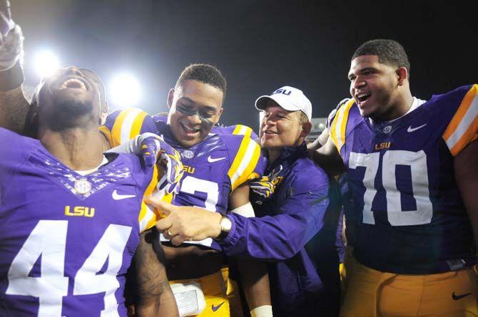 LSU head coach Les Miles sings the alma mater Saturday, Sep. 13, 2014 after the Tigers' 31-0 victory against ULM in Tiger Stadium.