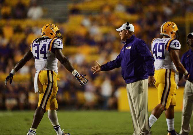 LSU football head coach Les Miles leans in to shake freshman running back Darrel Williams hand (34) Saturday, September 6, 2014 after the Tigers' 56-0 blow out against Sam Houston State in Tiger Stadium.