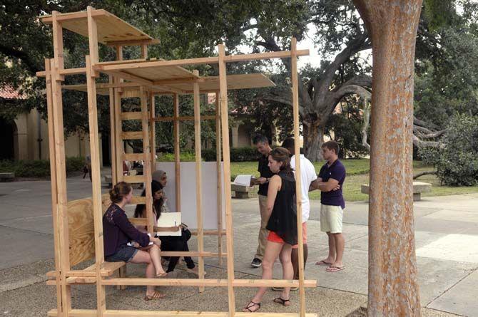 LSU architecture proffesor Robert Holton evaluates student built structures Monday, September 8, 2014 in the quad.