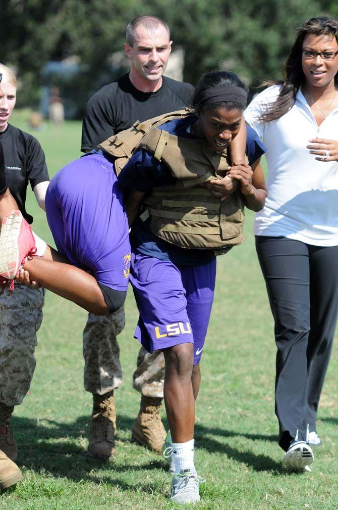 LSU women's basketball freshman forward Stephanie Amichia carries a teammate during practice with the marines on Friday September 19, 2014.