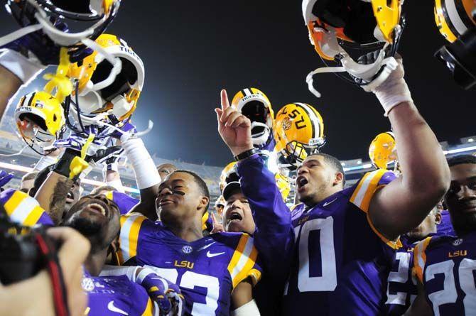 LSU head coach Les Miles sings the alma mater Saturday, Sep. 13, 2014 after the Tigers' 31-0 victory against ULM in Tiger Stadium.