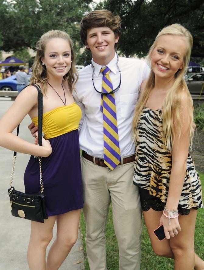 Fans pose in their gameday outfits Saturday, September 13, 2014 before the LSU vs ULM football game in Tiger Stadium.