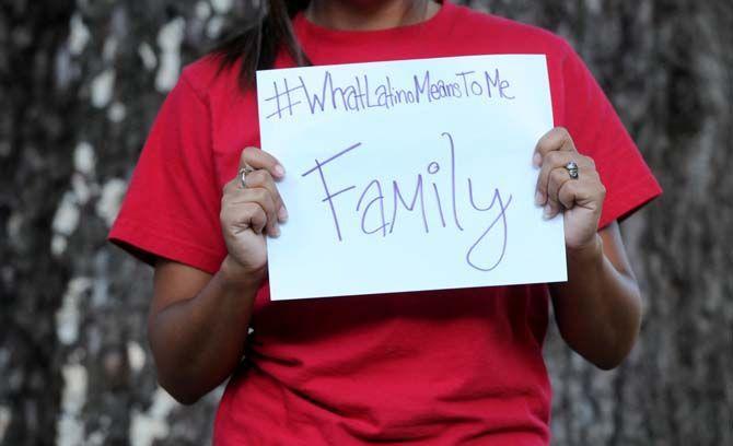 The Hispanic Student Cultural Society make signs about what being Latino means to them.