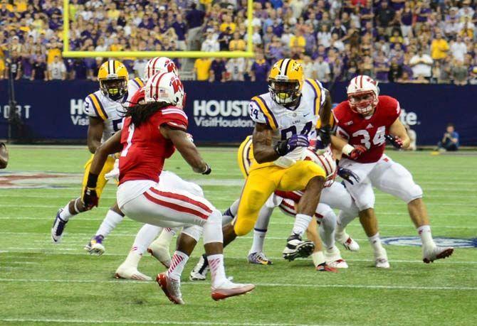 Danielle Hunter ( center #94 ) plays defense for LSU in the LSU vs Wisconsin game August 30, 2014.