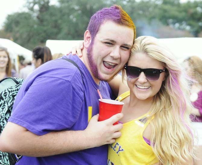 Fans pose in their gameday outfits Saturday, September 13, 2014 before the LSU vs ULM football game in Tiger Stadium.