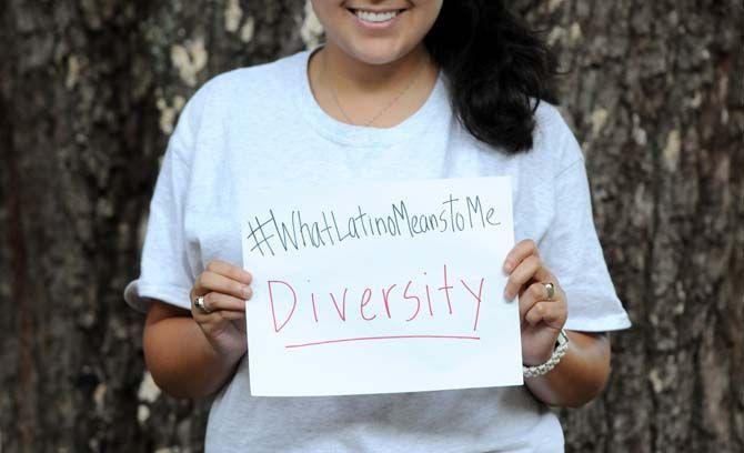 The Hispanic Student Cultural Society make signs about what being Latino means to them.