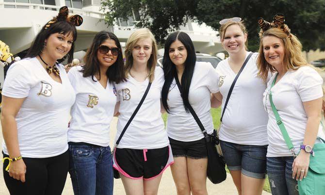Fans pose in their gameday outfits Saturday, September 13, 2014 before the LSU vs ULM football game in Tiger Stadium.