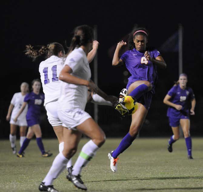 LSU sophomore forward Summer Clarke (4) leaps up for the ball Monday, September 8, 2014 during the Tigers' game against Stephan F. Austin in LSU Soccer Stadium.