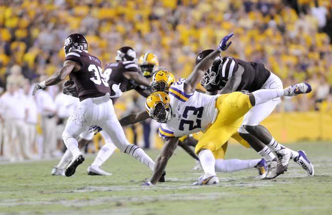 LSU junior linebacker Lamar Louis (23) misses Mississippi State freshman wide receiver Gabe Myles (35) at the game Saturday September 20, 2014 where LSU lost 34-28 in Tiger Stadium.