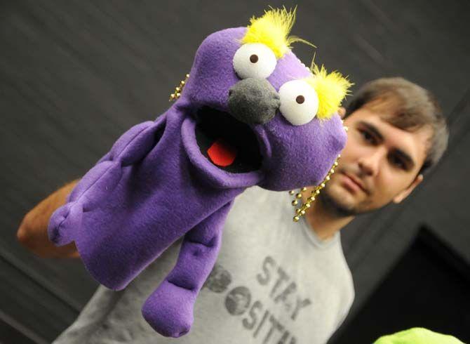 Mass Communication senior Adrian Wintz poses with puppet "Steve" that he made in Communication Studies 3900 in Black Box Theatre.